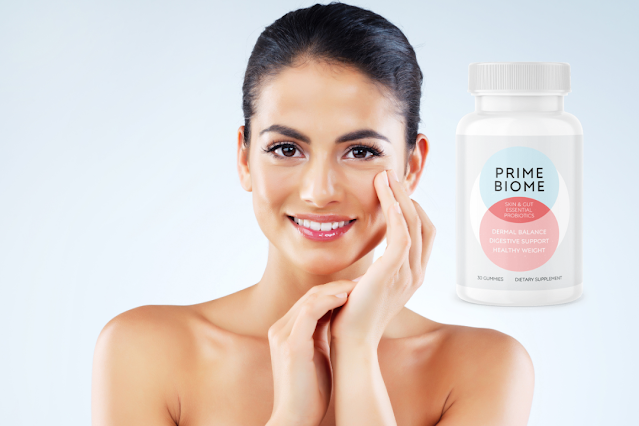 Woman with radiant skin holding PrimeBiome gummy for gut health and beauty.